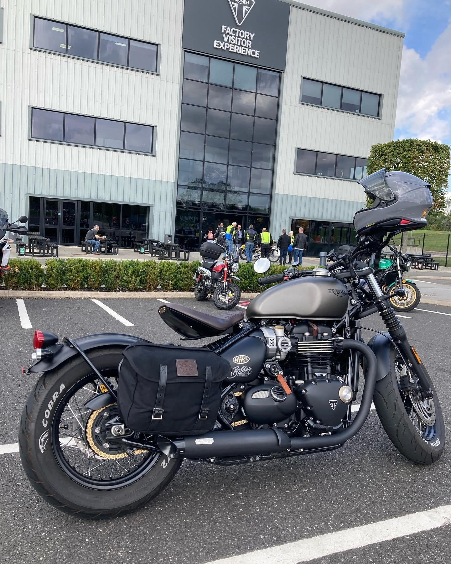 A Triumph Bonneville Bobber with waxed canvas panniers