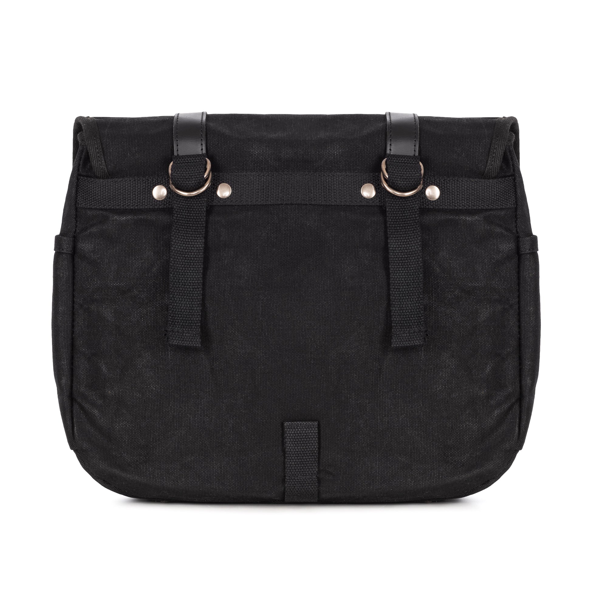 The back of a black waxed canvas motorcycle pannier bag with side release buckles and a detachable shoulder strap.