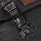 A black waxed canvas motorcycle pannier bag side release buckles