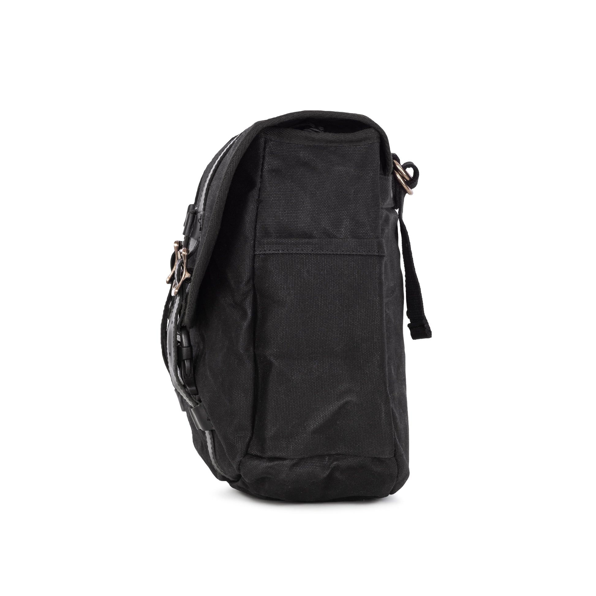 A side view of a black waxed canvas motorcycle pannier bag with side release buckles and a detachable shoulder strap.