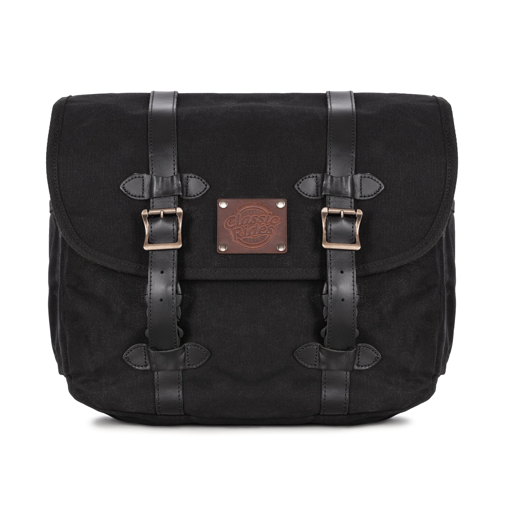 A black waxed canvas motorcycle pannier bag with side release buckles and a detachable shoulder strap.