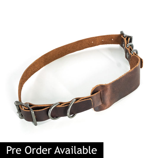 A brown leather motorcycle seat strap for attaching luggage